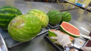 Watermelons being sliced at the Soup Kitchen of Muncie