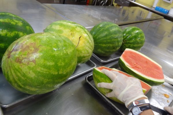 Watermelons being sliced at the Soup Kitchen of Muncie