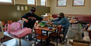 Volunteers sorting donations